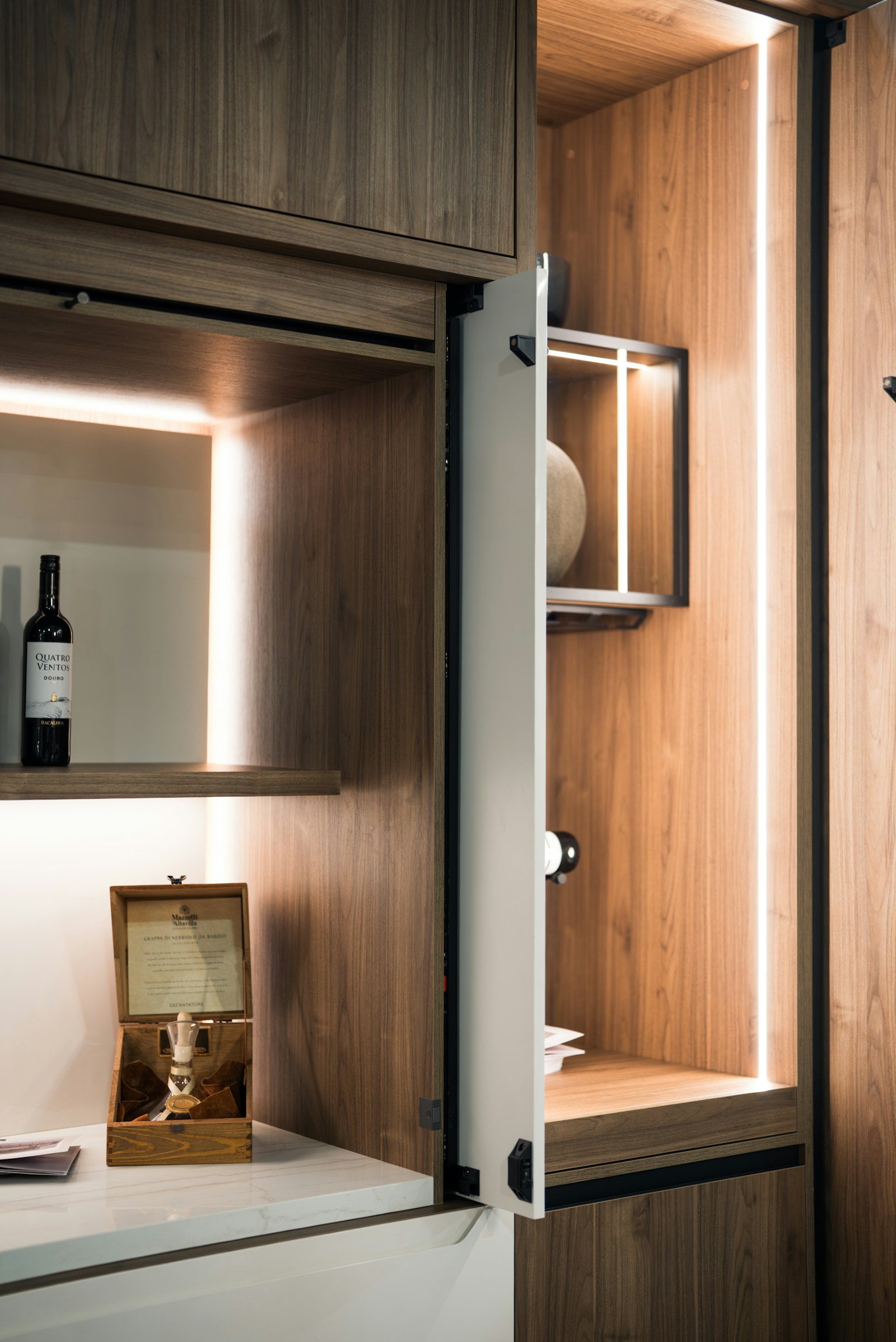 Wood cabinetry with integrated lighting and decorative objects